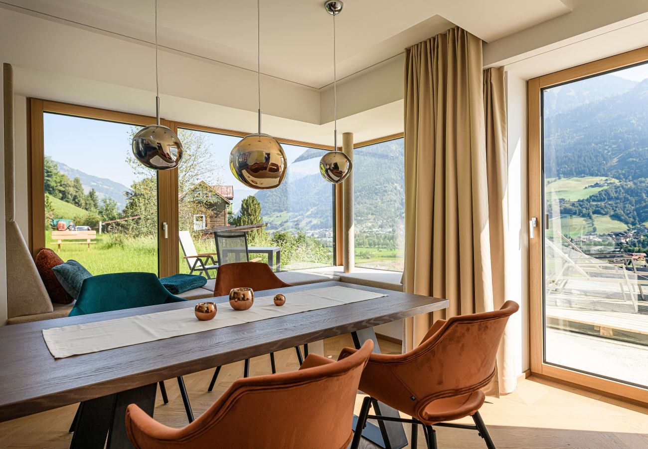 Dining area with large windows and mountain panorama in Bad Hofgastein